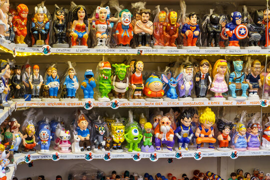 Caganers, sale in a Christmas market in Barcelona figurine in the nativity scenes, as a tradition in Catalonia, usually hidden in a corner, behind a bush, crouched and in a posture of being defecating