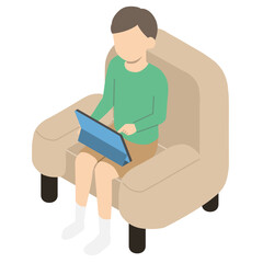 ソファーに座ってタブレットを操作する男の子