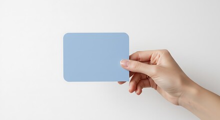 Obraz premium Blue Card Held by Hand