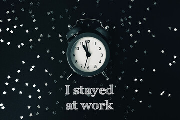 Vintage alarm clock on dark background with scattered silver stars and motivational text design