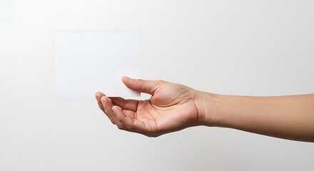 Fototapeta premium White Card Held by Hand