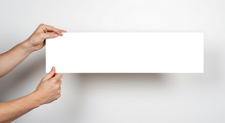 White Sign Held by Hands