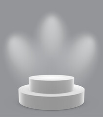 Two-tiered white circular pedestal on a gray background illuminated by three angled spotlights, creating soft shadows and dramatic studio lighting for product presentation or display.