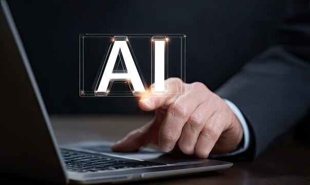 Businessperson's hand touches a glowing AI text overlay on a laptop