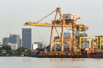 Obraz premium Container cargo freight ship at port in the morning