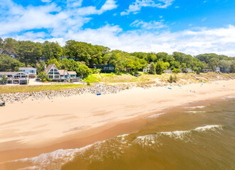Aerial View of Norton Shores Beachfront Homes and Lake Michigan Shoreline on a Bright Summer Day in Michigan”