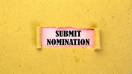 SUBMIT NOMINATION written on torn paper isolated on pink background.
