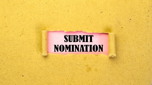 SUBMIT NOMINATION written on torn paper isolated on pink background.