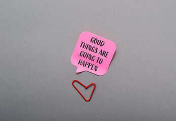 Colorful speech bubble with motivational quote and red paperclip heart on gray background