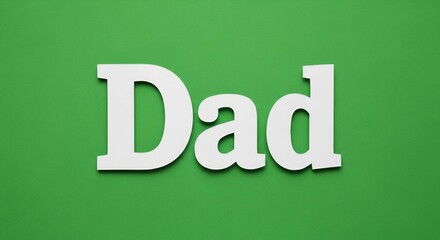 White 'Dad' lettering on a vibrant green background, evoking a feeling of appreciation and love