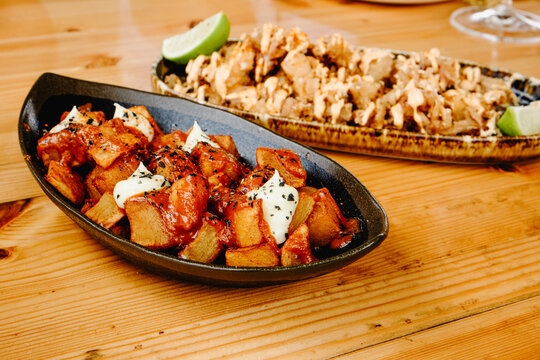  spanish patatas bravas and chipirones tapas