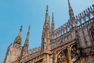 gothic spires on the rooftop of Milan Cathedral