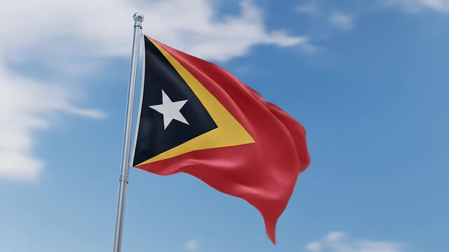 The flag of East Timor waving in the wind against a bright, cloudy sky.