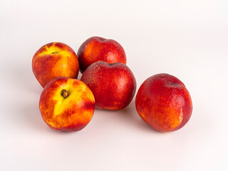 Fresh ripe nectarines on white background, grouped
