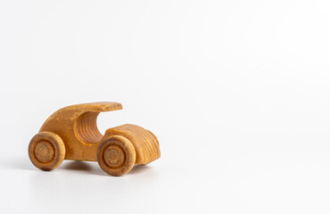 Vintage wooden toy car on white background, simple eco-friendly children's plaything
