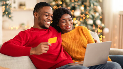 Online shopping and present for family with delivery. Young happy african american guy and female...