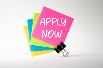Apply now symbol. Concept word Apply now on sticky note. Beautiful white background. Business and Apply now concept. Copy space