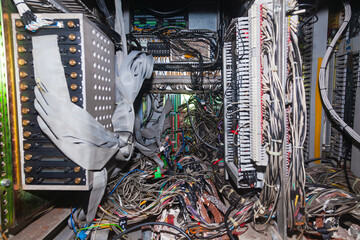 Bunch of connected server electrical cables in a distribution box.