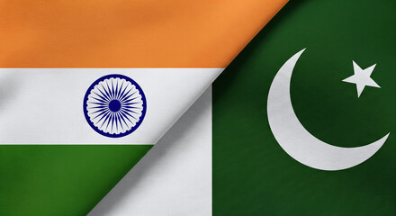 India and Pakistan Flags With Soft Cloth Texture Meeting at Center With Shadow Line JPG