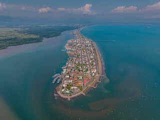 Beautiful aerial and coastal views of Puntarenas, Costa Rica — featuring the iconic red-and-white lighthouse, scenic peninsula, calm beaches, and authentic seaside charm.