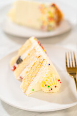 Tall vanilla cake with frosting details