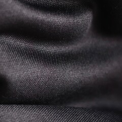 Black fabric texture with soft folds and fine weave
