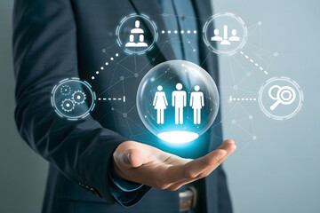 Businessman holding a glowing sphere with people icons representing team collaboration and success