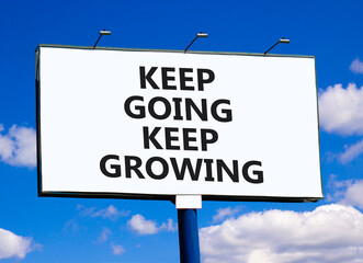 Keep going and growing symbol. Concept words phrase Keep going keep growing on beautiful big white billboard. Beautiful blue sky cloud background. Business Keep going and growing concept. Copy space.
