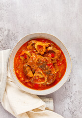ossobuco, stewed meat knuckle on the bone, with oats and spices, homemade, no people,