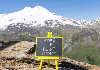 Make the right choice symbol. Concept words phrase Make the right choice on beautiful black blackboard. Beautiful mountain Elbrus background. Business Make the right choice concept. Copy space.