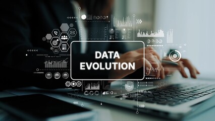 Business professional typing on laptop with overlay graphics showcasing data evolution and analytics concepts. Asymptotic smart data analytic.
