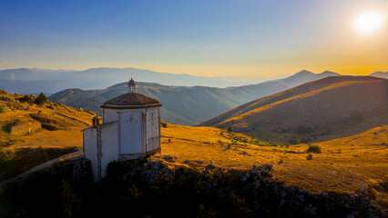 Italy, July 5, 2025: Ruins of Rocca Calascio Castle, an Italian tourist destination and landmark in the Gran Sasso National Park, L'Aquila, Abruzzo. Clear blue skies at sunset.