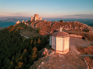 Italy, July 5, 2025: Ruins of Rocca Calascio Castle, an Italian tourist destination and landmark in the Gran Sasso National Park, L'Aquila, Abruzzo. Clear blue skies at sunset.
