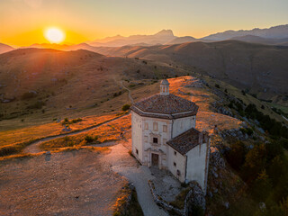 Italy, July 5, 2025: Ruins of Rocca Calascio Castle, an Italian tourist destination and landmark in the Gran Sasso National Park, L'Aquila, Abruzzo. Clear blue skies at sunset.