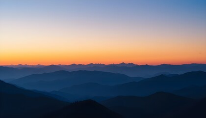 Fototapeta premium Distant Ridge Silhouette at Sunset: Layers of Blue and Purple Mountains