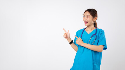 Asian woman medical nurse pointing to side in a promotion gesture, the young friendly nurse in...