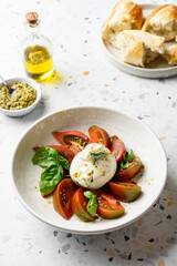burrata with tomatoes, basil and pesto