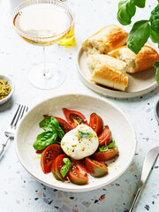 burrata with tomatoes, basil and pesto