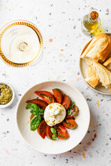 burrata with tomatoes, basil and pesto