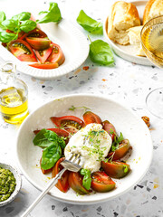 burrata with tomatoes, basil and pesto