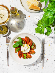 burrata with tomatoes, basil and pesto