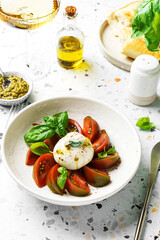burrata with tomatoes, basil and pesto