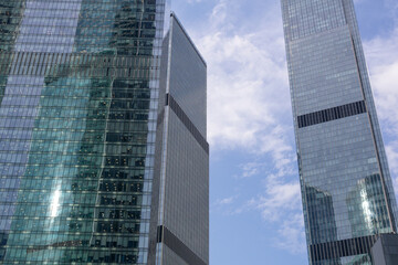 Low angle view of modern skyscrapers glass walls