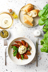 burrata with tomatoes, basil and pesto