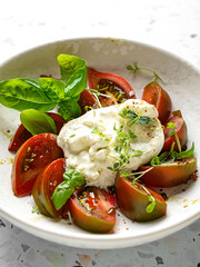 burrata with tomatoes, basil and pesto
