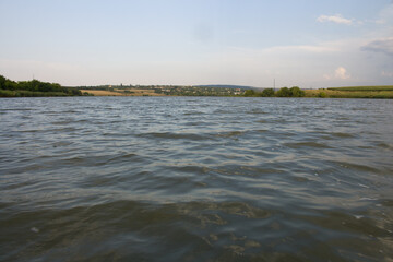 A body of water with land in the background