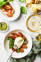 burrata with tomatoes, basil and pesto