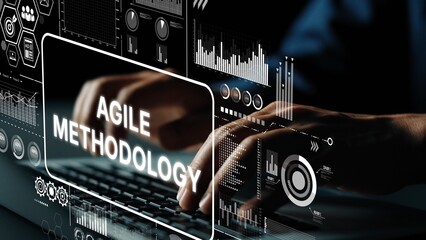Obraz premium Innovative Agile Methodology Concept with Graphic Data Visualizations and Keyboard Interaction in Modern Workspace. Asymptotic smart data analytic.