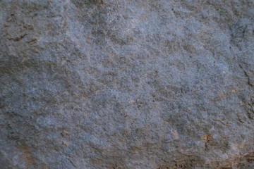 Close-up of grey stone surface texture, natural rock background
