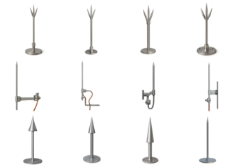 Set of metal lightning rods with pointed and multi-prong tips for building protection; various rooftop lightning arrestors mounted on base plates and brackets with grounding cable options